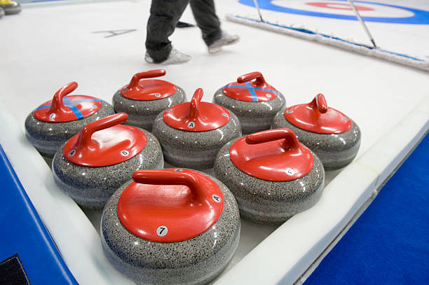istock Group of curling rocks on ice 104095593
