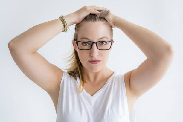 istock Confident pretty woman holding hands on head 1040959788