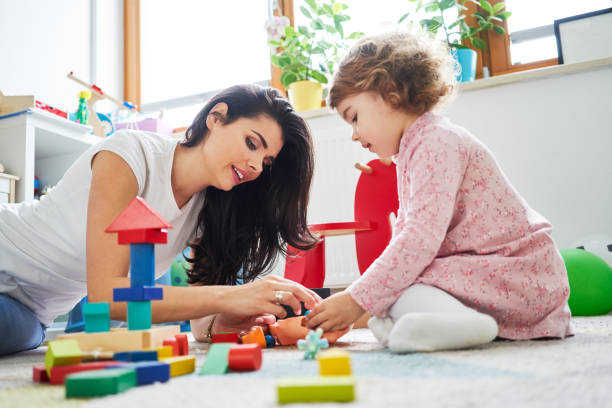 istock Young mother playing with toys with her daughter 1040960062