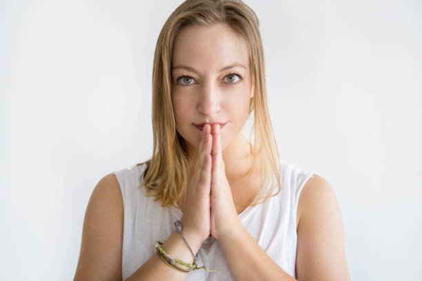 istock Serious woman keeping hands together 1040960342