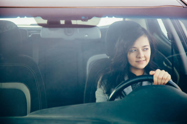 istock Young woman on the car. 1040961306