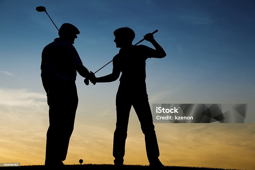 Par sênior Jogando Golfe no pôr do sol - Royalty-free Golfe Foto de stock