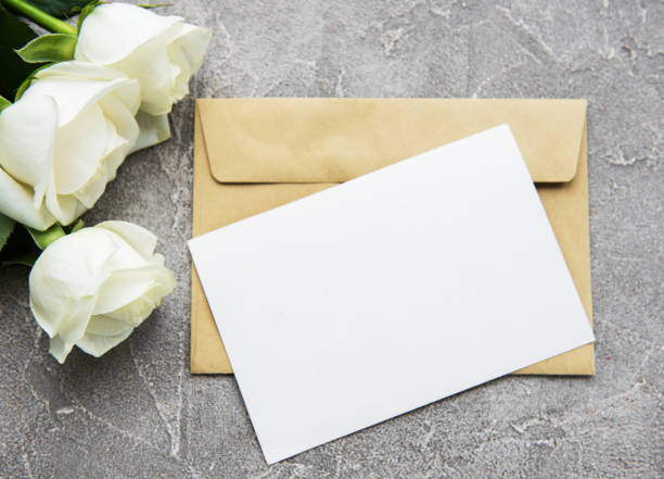 istock White roses and greeting card 1040963382