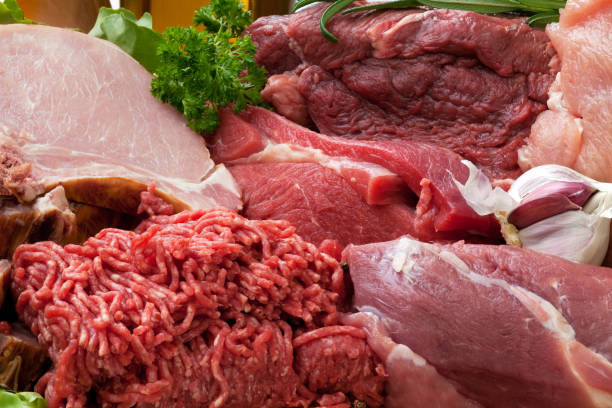 istock Raw fresh meat ingredients on board with condiments 1040966728