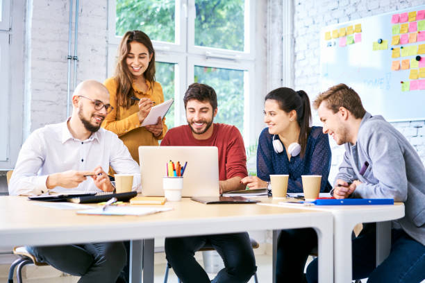 istock Attractive students using laptop and studying together. Startup entrepreneurs at work 1040971064