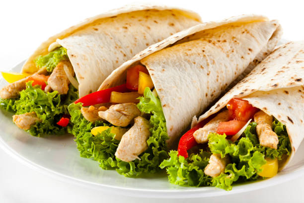 istock Assorted delicious tacos meat with vegetables isolated 1040974014