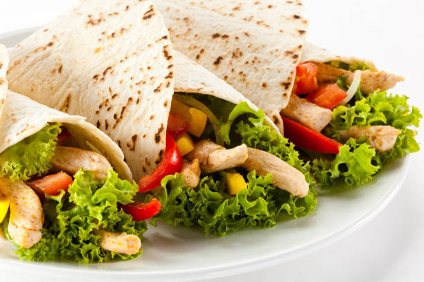 istock Assorted delicious tacos meat with vegetables isolated 1040974166