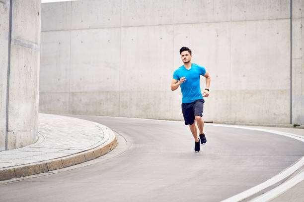 istock Athletic man sprinting during jogging session in the city 1040977084