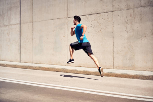 istock Muscular man doing jogging and jumping exercises during outdoors workout in the city 1040980986