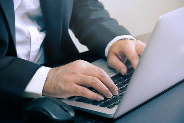 istock Businessman 's hands are typing on notebook keyboard 1040982550