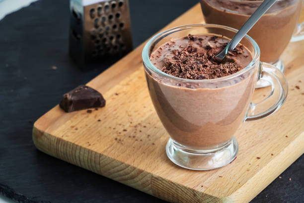 istock Healthy paleo chocolate yogurt dessert. Dark background. 1040985096