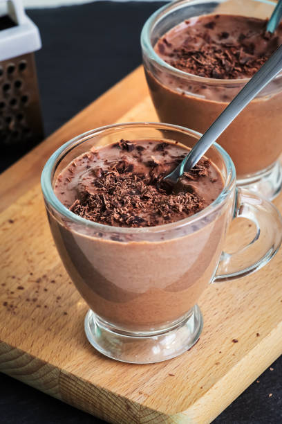 istock Healthy paleo chocolate yogurt dessert. Dark background. 1040985134