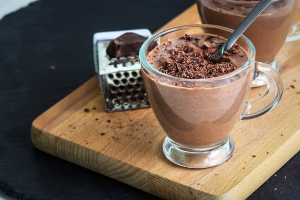 istock Healthy paleo chocolate yogurt dessert. Dark background. 1040985388