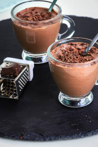 istock Healthy paleo chocolate yogurt dessert. Dark background. 1040986386