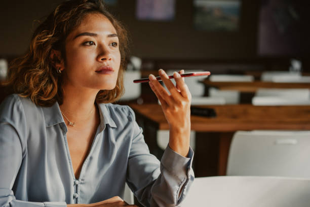 istock Content Woman Talking on Phone with Loudspeaker 1040991322