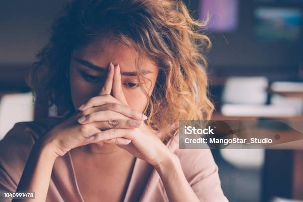 Tired Young Woman Leaning Head On Hands Stock Photo - Download Image Now - Women, Emotional Stress, One Woman Only