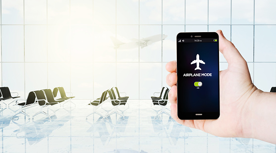 smartphone with airplane with airport lounge