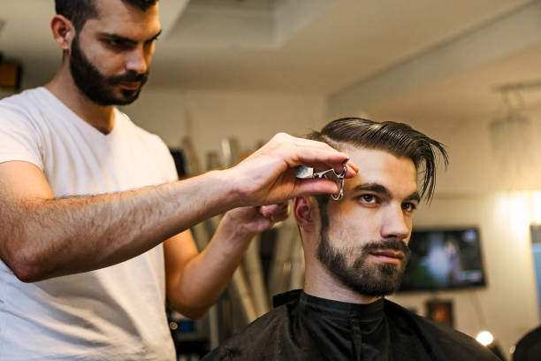 istock Styling hair by professional 1040997942