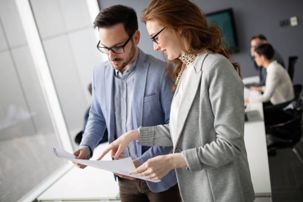 istock Business people planning strategy in office together 1040998090