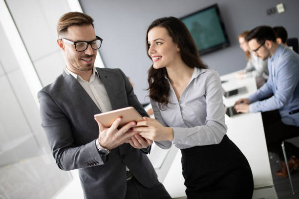 istock Group of business people collaborating in office 1040998092