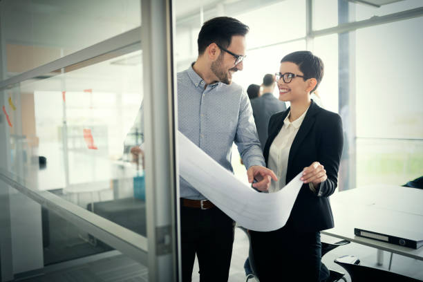 istock Group of architects and business people working together 1040998196