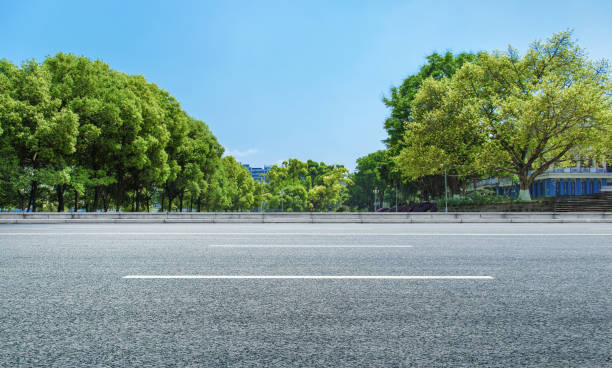 istock City park and clean asphalt road 1040998688