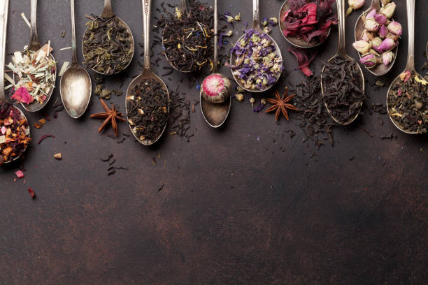 Various tea in spoons. Black, green and red tea