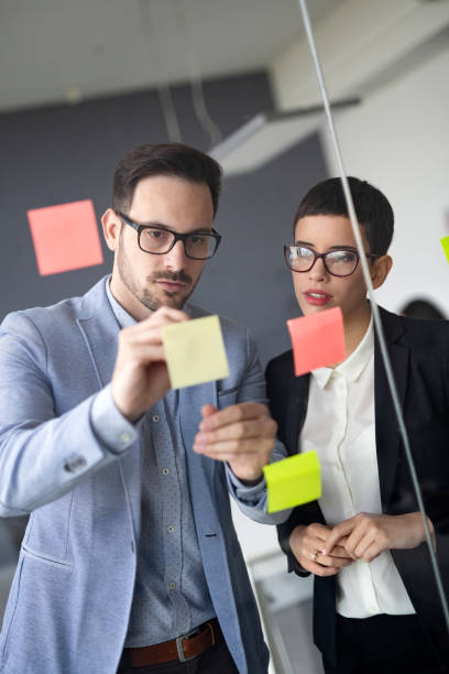 istock Business people planning strategy in office together 1041004774