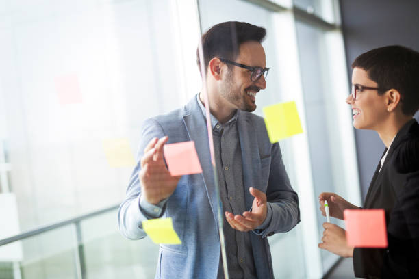 istock Business people meeting at office and use sticky notes to share idea 1041004870