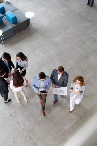 istock Group of business people collaborating in office 1041005388