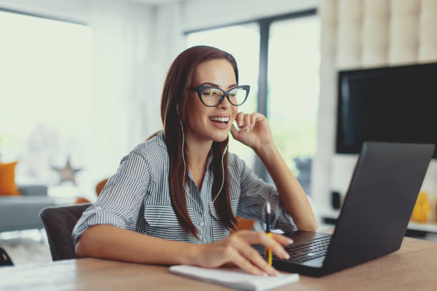 istock Happy young nerd university student laughing at laptop 1041005568