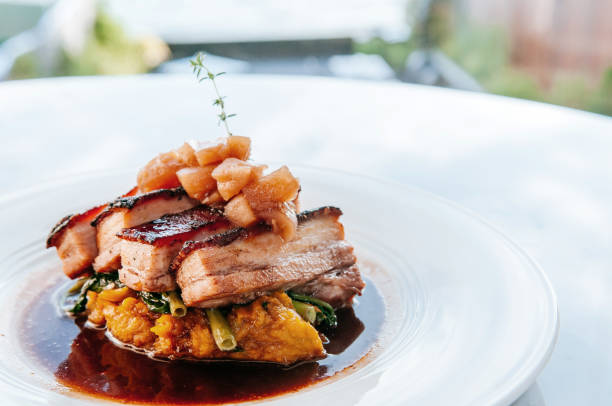Braised pork belly in brown sauce with vegetables, modern Chinese cuisine