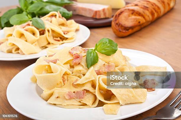 Two Servings Of Homemade Pasta Carbonara Stock Photo - Download Image Now - Bacon, Basil, Bread