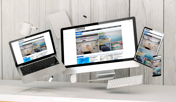 istock floating devices at the office with trends magazine homepage on screen 1041015850