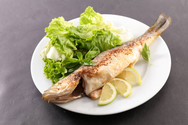 istock plate with grilled fish and salad 1041018524