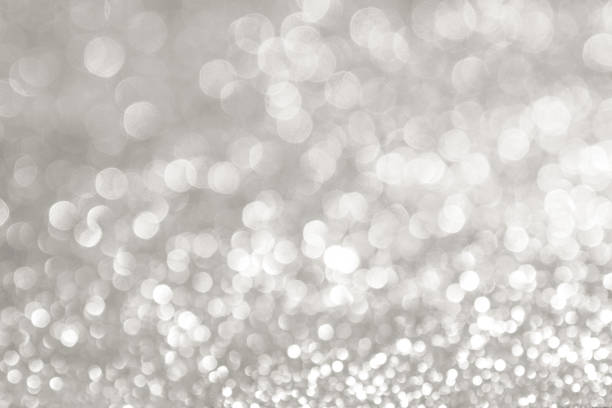 istock abstract background white Silver lights on christmas bokeh 1041029360