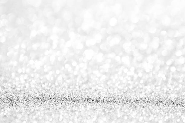 istock abstract background white Silver lights on christmas bokeh 1041030906