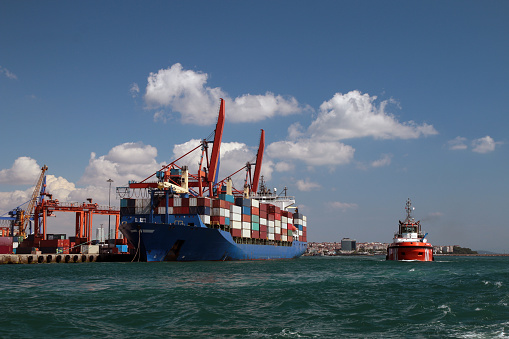 Ship and tugboat in the harbor