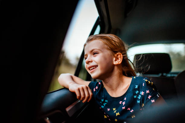 istock Girl looking out car window 1041050840