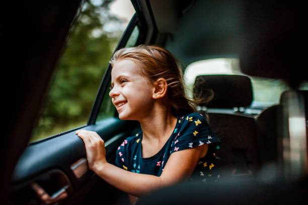 istock Girl looking out car window 1041050936