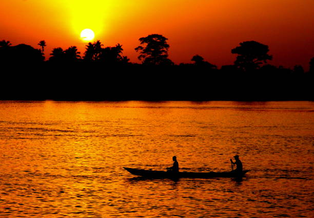 istock Fishermen at Sunrise, Volata River, Ghana 1041052296