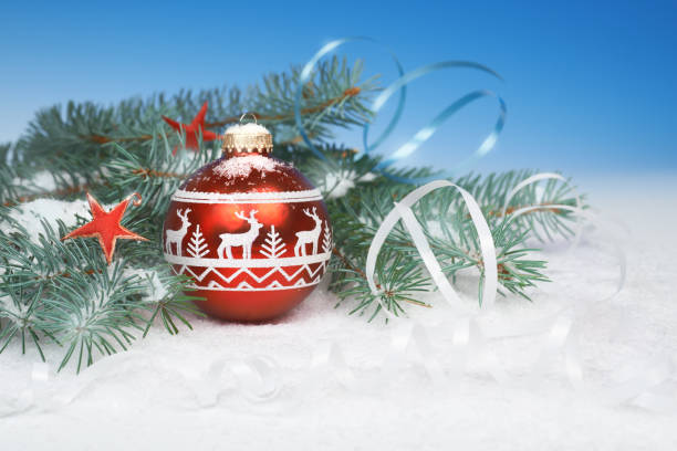 istock Christmas decorations in red and gold on abstract winter background 1041056716