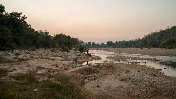 istock The sun setting over a dried river bed in India 1041062022