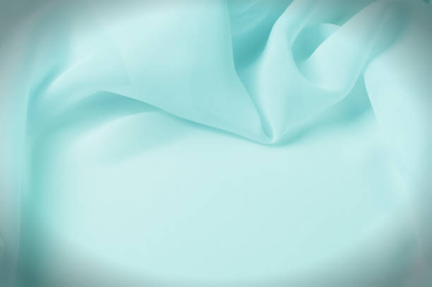 istock Texture, background, pattern. Silk fabric Light green, abstract folds. 1041062292