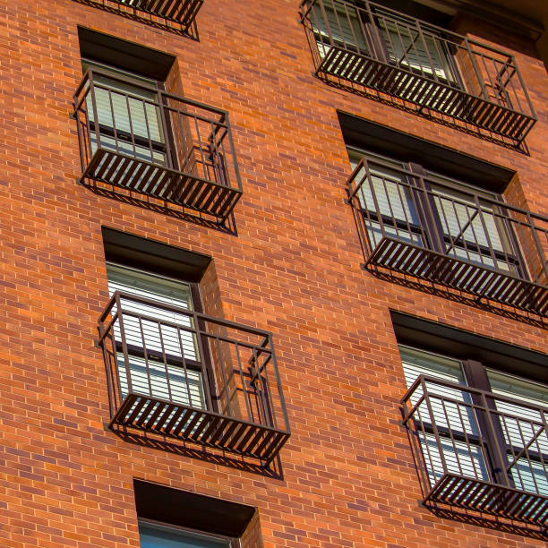 istock High rise with narrow balconies and brick wall 1041063070
