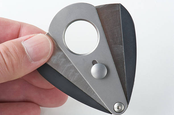 istock Cigar cutter held by male hand 104106368