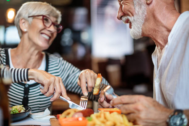 istock Senior couple eating in the restaurant 1041068488