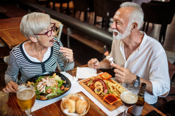 istock Senior couple eating in the restaurant 1041068706