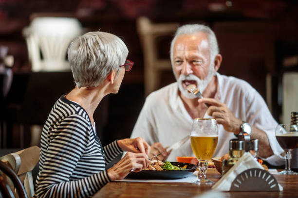 istock Senior couple eating in the restaurant 1041068934