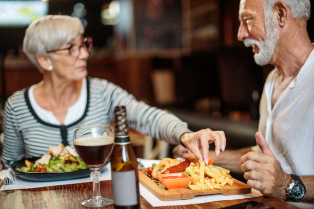 istock Senior couple eating in the restaurant 1041069630